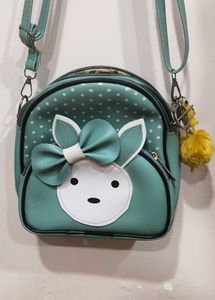 Cute Teal Crossbody Bag with Charm and keychain.