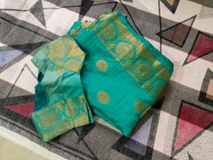 Elegant Teal Saree with Gold Border