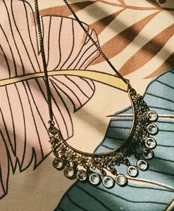 BRASS Necklace with floral designs.