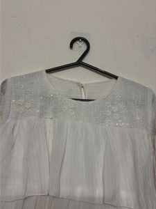 Elegant White Tiered Blouse