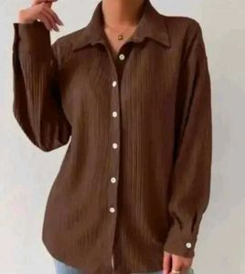 brown shirt with black buttons