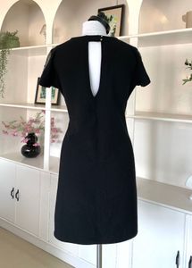 Elegant Black Dress with Embellished Sleeves