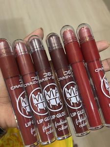 matte liquid lipstick with lip cryon on tip.