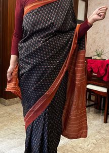 Elegant Black Saree with Orange Border