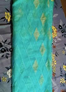 Elegant Teal Saree with white Diamond type Pattern