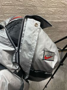nike lightweight silver jacket