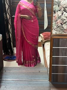 Elegant Pink Saree with Golden Detailing