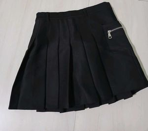 Classic black pleated mini skirt.