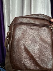 brown sling bag