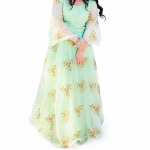 Elegant Pastel Gown with Golden Embroidery