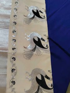 Elegant Cream Saree with Peacock Design