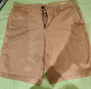 Green Tshirt with Tan shorts