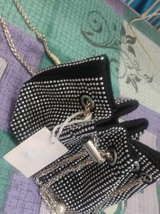 new sling potli bag black and silver in coulour...