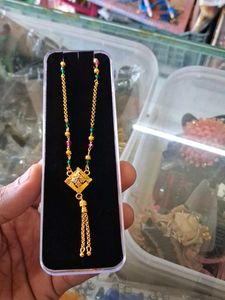 Elegant Gold Necklace with Emerald & Ruby Accents