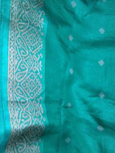 Elegant Teal Saree with Subtle Motifs