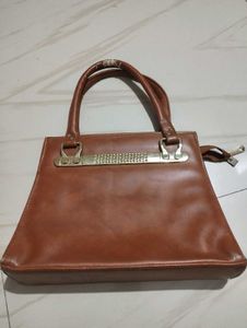 Chic Brown Handbag with Embellished Handle