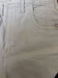 Cream straight leg jeans