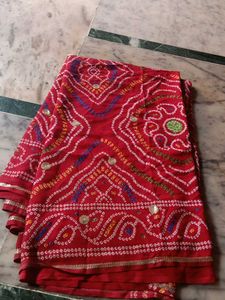 Vibrant Red Bandhani Saree with Intricate Designs
