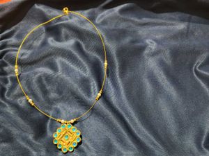Elegant Gold Necklace with Blue Stones