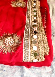 Red saree with mirror work border