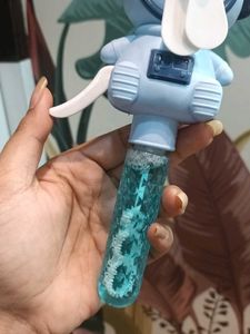 Bubble making toy with fan