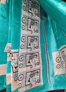 Elegant Teal Silk Saree with Unique Print