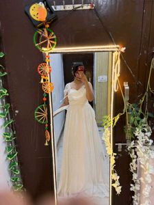 white full length gown with too much detailing