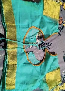 Elegant Teal Saree with white Diamond type Pattern