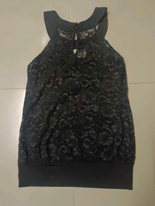 Black halter neck top.