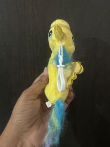small yellow plush unicorn