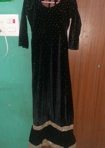 Elegant Black Velvet Gown with Gold Embellishments