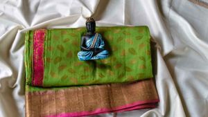 Vibrant Green Saree with Pink Border