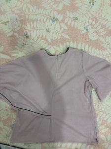 Elegant new rareism top