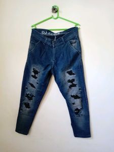 men's heavily distressed / ripped blue denim jeans