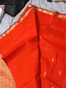 Vibrant Orange Saree with Gold Border