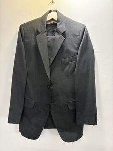 A crisp dark grey custom tailored suit
