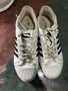 White Sneakers with Black Stripes