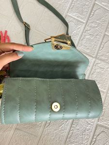 Green Roll shaped sling bag