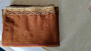 Elegant Brown Striped Saree with Gold Embroidery