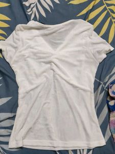 white top shimmery ish material
