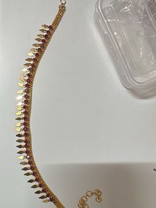 Gold necklace (elakkathali) with Red Stones