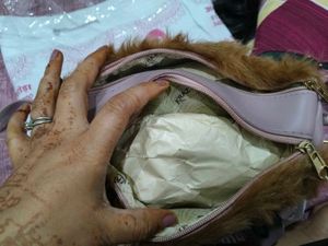brown fur sling bag