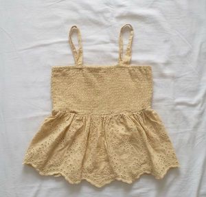 Smocked Eyelet Peplum Top