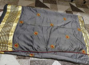 Elegant Grey Saree with Gold Border