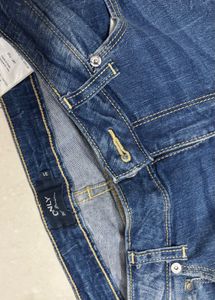 Distressed Blue Denim Jeans with Zipper Cuffs