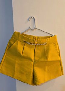 High-Waisted Yellow Shorts with Chain Detail