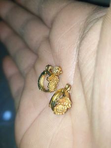 Gold Dangle Earrings with Intricate Design