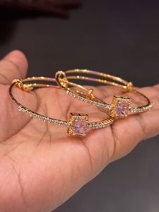Elegant Gold Bangles with Pink Stones
