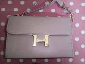 Stylish Beige Handbag with “H” Logo