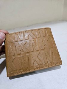 Tan Embossed Monogram Wallet